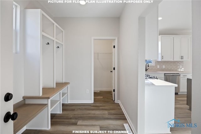 mudroom featuring sink and dark hardwood / wood-style floors