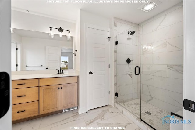 bathroom with a shower with door and vanity