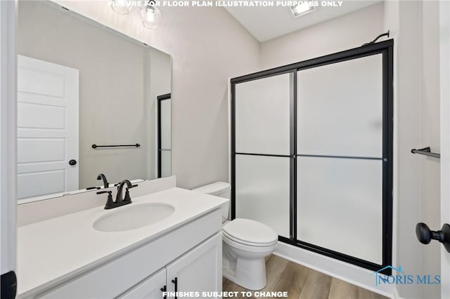 bathroom featuring vanity, hardwood / wood-style flooring, a shower with door, and toilet