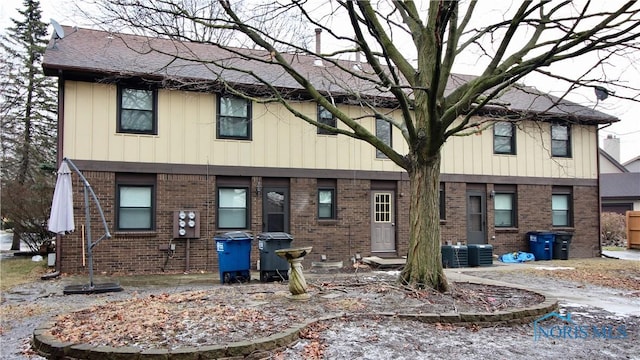 rear view of house with central air condition unit