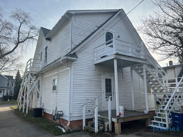 rear view of house with central AC