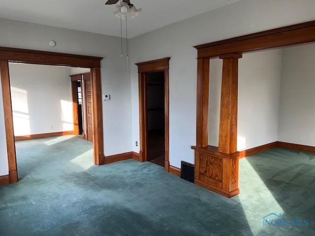 unfurnished bedroom featuring ceiling fan and carpet floors