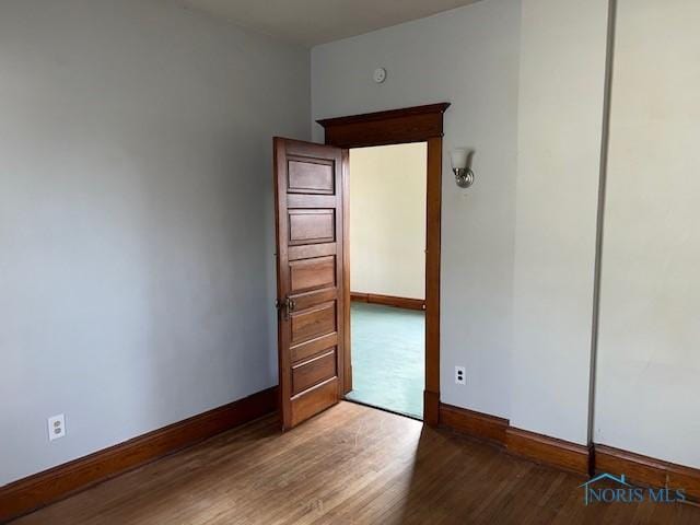 empty room featuring dark hardwood / wood-style floors