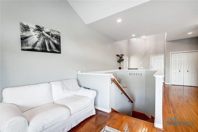 sitting room with hardwood / wood-style flooring