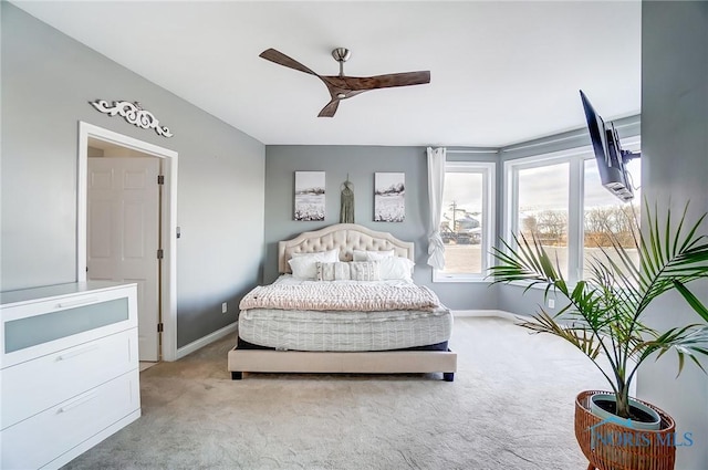 bedroom with light colored carpet and ceiling fan