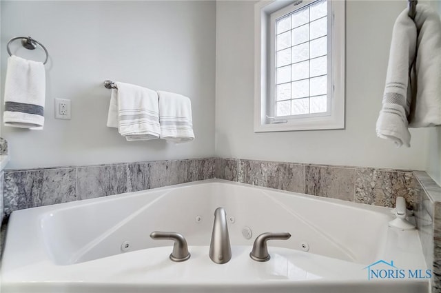 bathroom with a tub