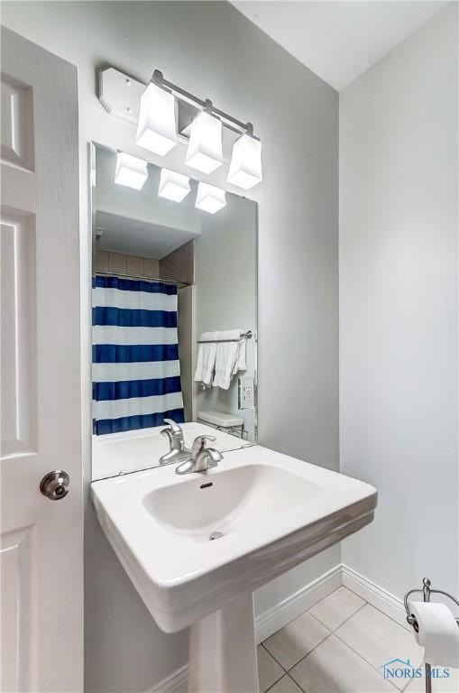 bathroom featuring tile patterned flooring and a shower with curtain