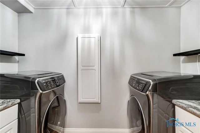 laundry room featuring washer and clothes dryer