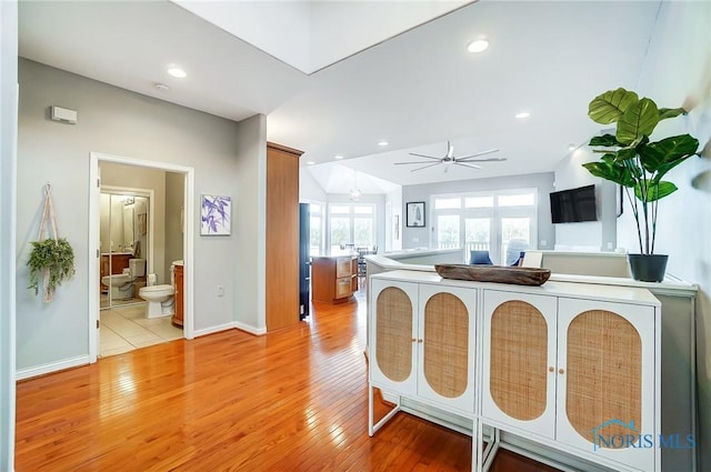 kitchen featuring ceiling fan and light hardwood / wood-style floors