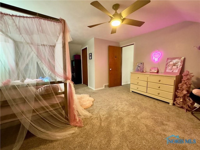 carpeted bedroom with ceiling fan