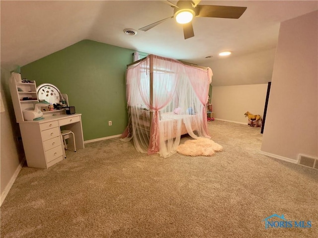 unfurnished bedroom featuring ceiling fan, light colored carpet, and lofted ceiling