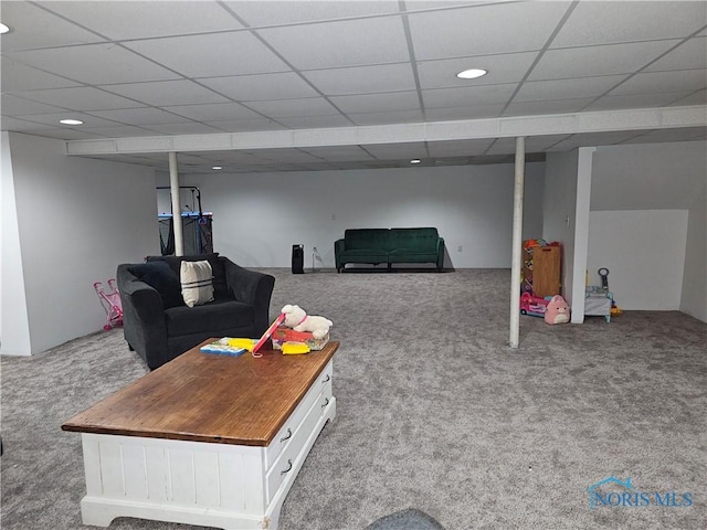 carpeted living room with a drop ceiling