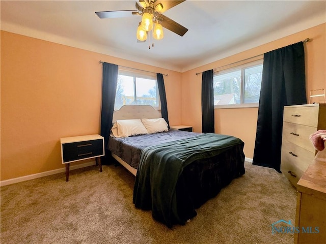 bedroom featuring light carpet and ceiling fan