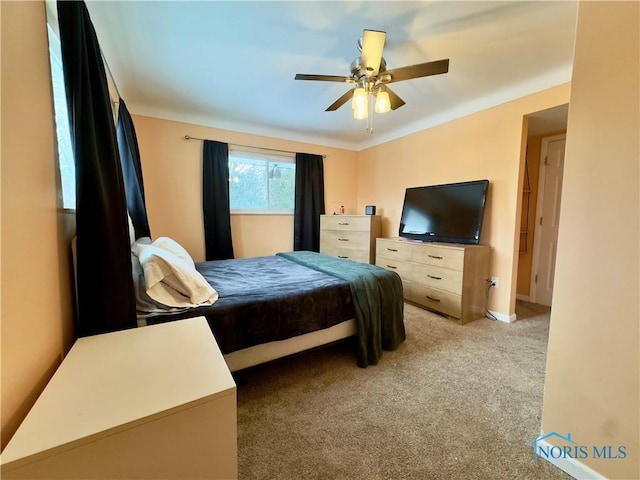 carpeted bedroom with ceiling fan