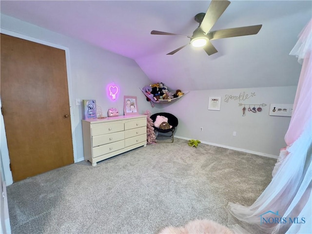 bedroom featuring lofted ceiling, ceiling fan, and carpet