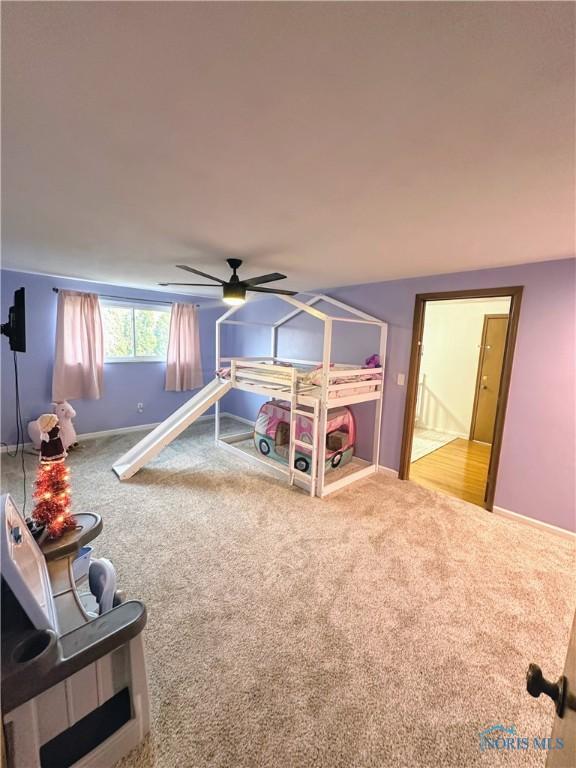 bedroom with ceiling fan and carpet floors