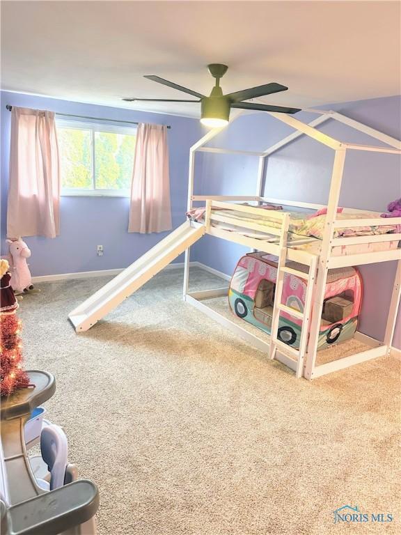 carpeted bedroom featuring ceiling fan