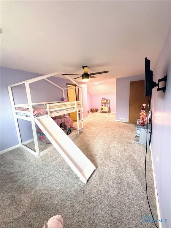 unfurnished bedroom featuring carpet floors and ceiling fan