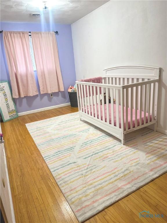 bedroom featuring hardwood / wood-style flooring