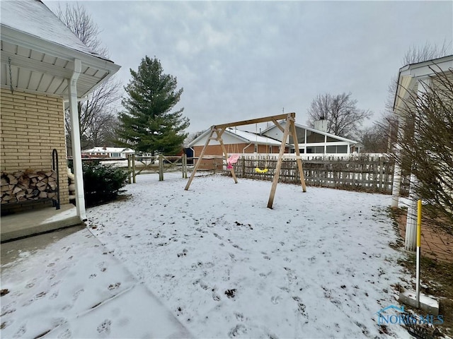 view of yard layered in snow