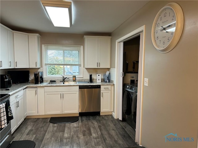 kitchen featuring sink, stainless steel dishwasher, and white cabinets