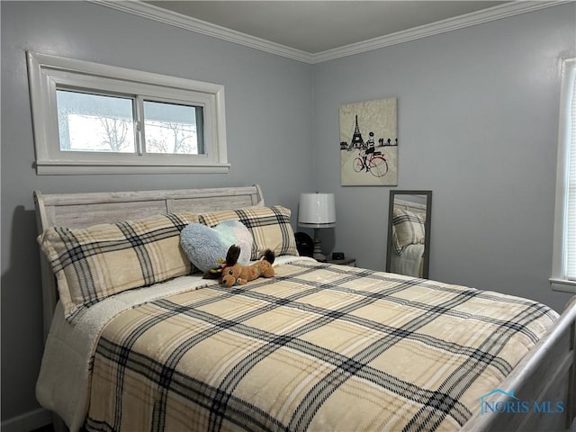 bedroom featuring crown molding