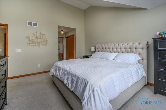 carpeted bedroom featuring vaulted ceiling