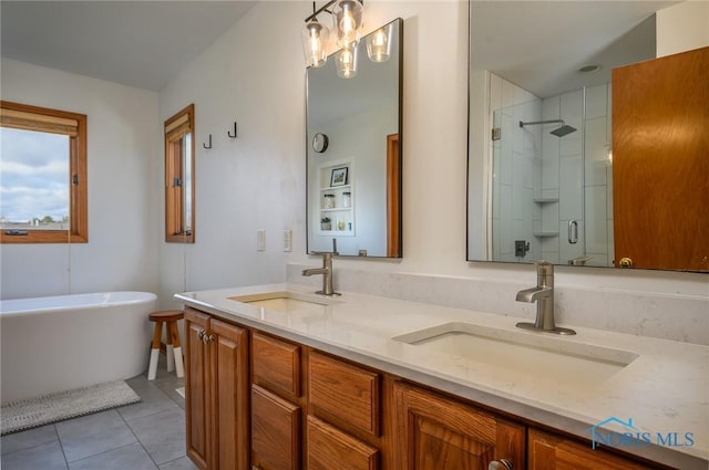 bathroom featuring vanity, separate shower and tub, and tile patterned floors