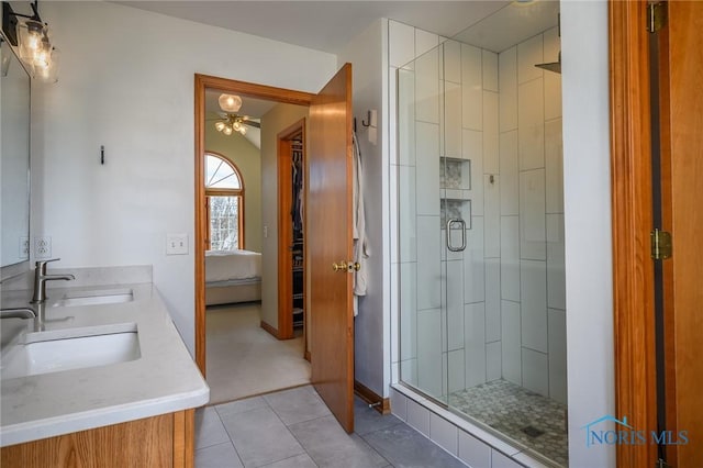 bathroom with vanity, tile patterned floors, and a shower with shower door