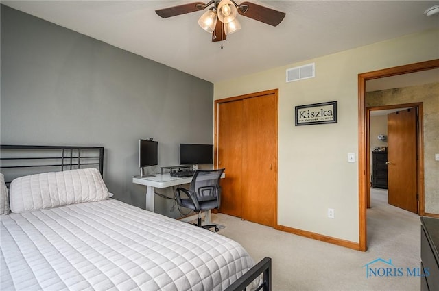 bedroom with ceiling fan and light colored carpet