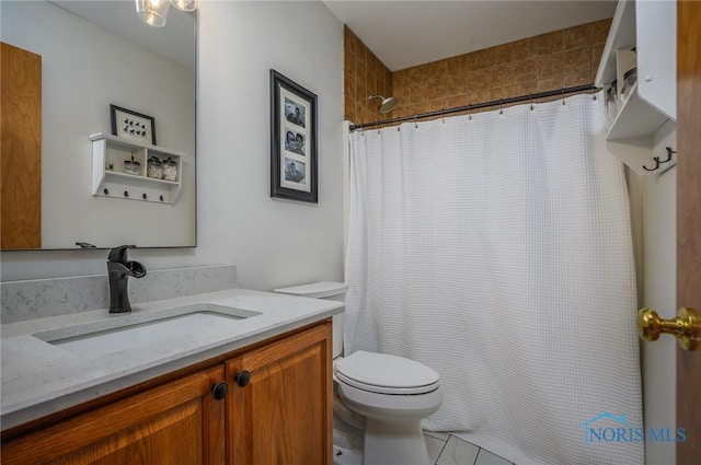 bathroom featuring vanity, curtained shower, and toilet