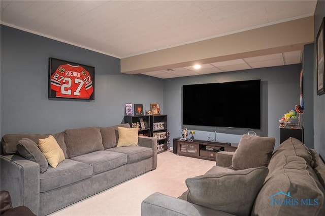 carpeted living room featuring ornamental molding