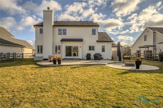 back of property featuring a yard and a patio