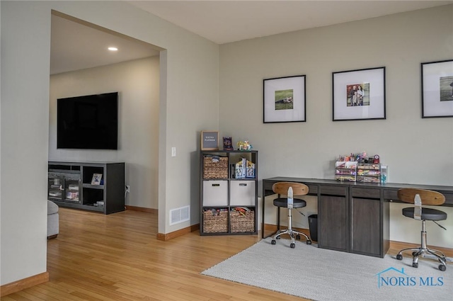 office area with light hardwood / wood-style flooring