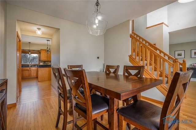 dining space with light hardwood / wood-style floors