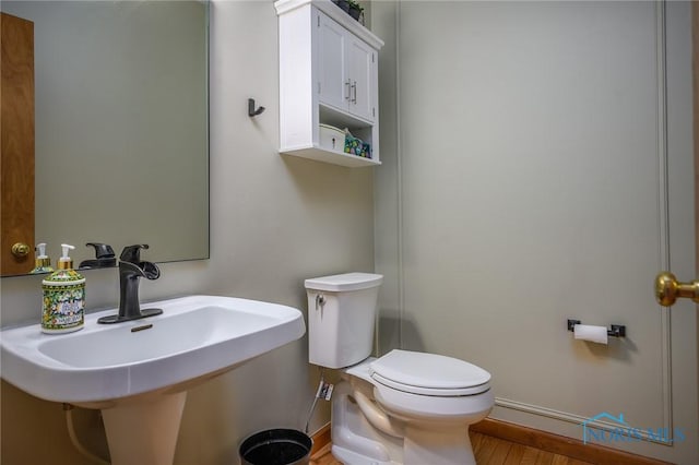 bathroom with toilet and sink