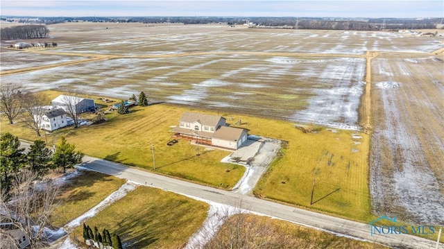 birds eye view of property with a rural view