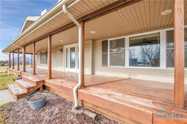 wooden terrace with a porch