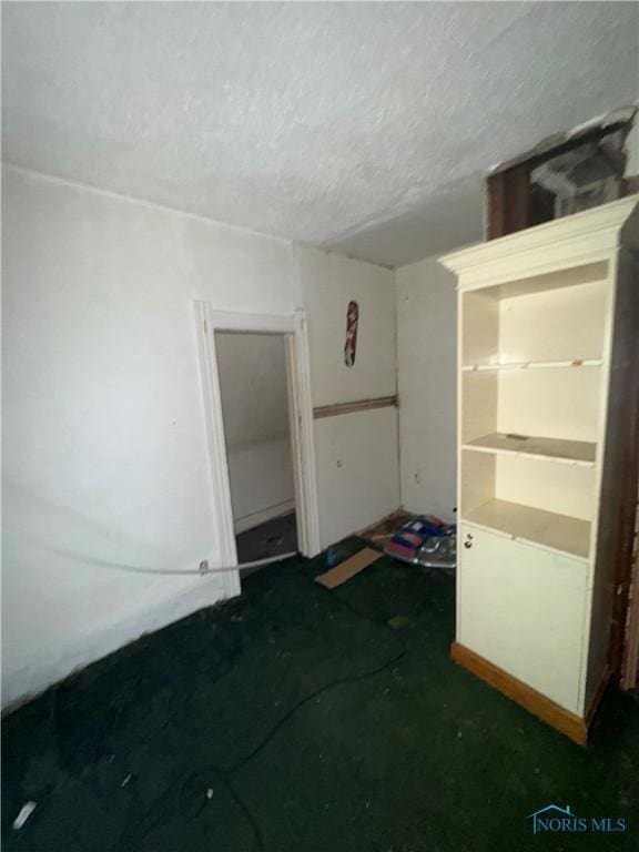 spare room featuring a textured ceiling