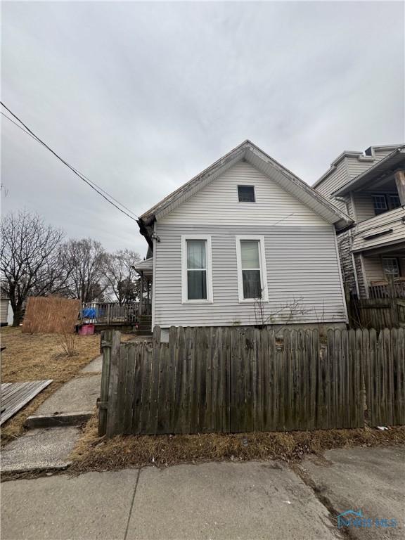 view of side of property with fence