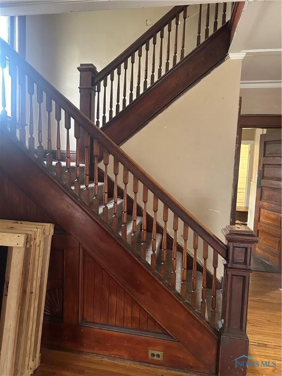 staircase featuring hardwood / wood-style floors