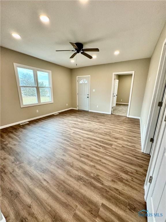 interior space featuring ceiling fan and wood-type flooring