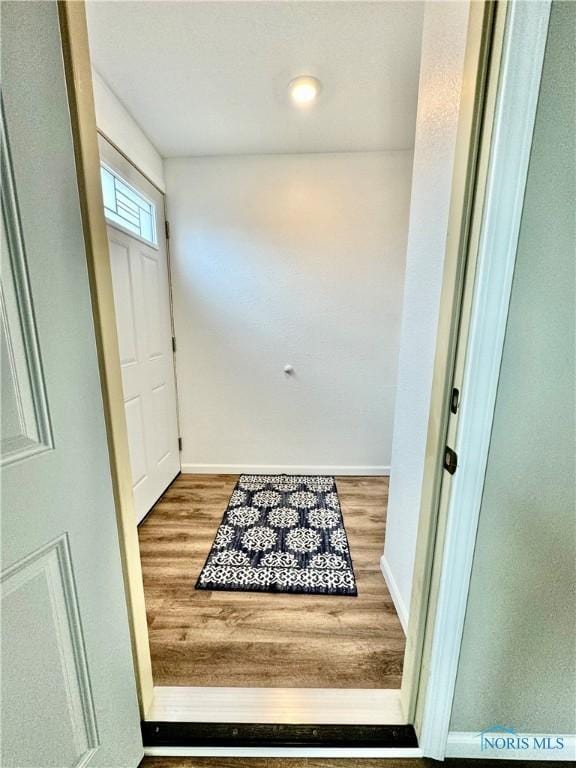 doorway to outside with hardwood / wood-style flooring