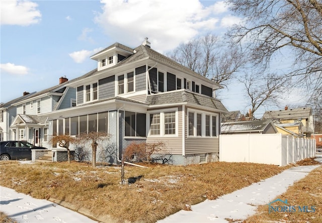 exterior space featuring a sunroom