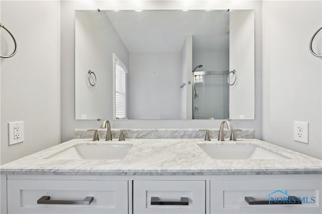 bathroom featuring vanity and walk in shower