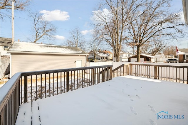 view of snow covered deck