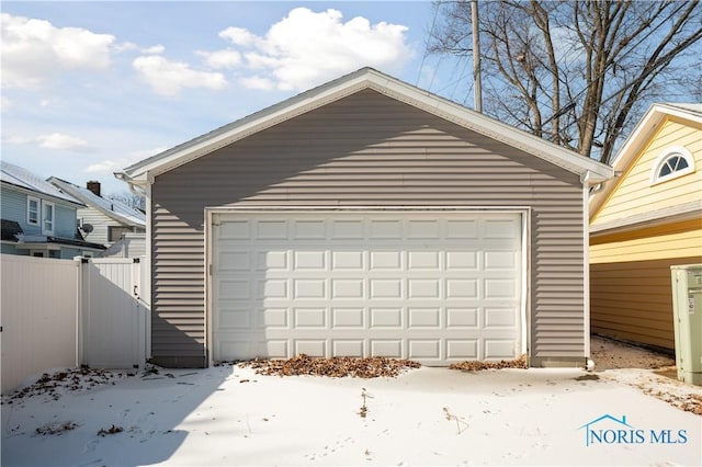 view of snow covered garage