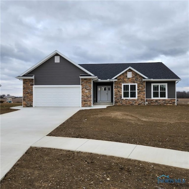 9223 Hiegel Dr, Findlay, OH 45840 - view of front of home with a garage