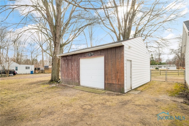 garage featuring a yard