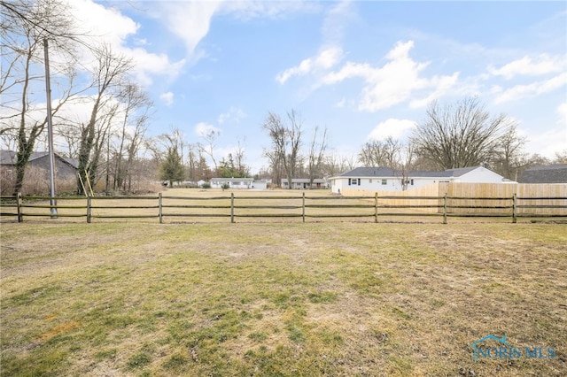 view of yard with a rural view